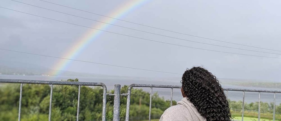 Shylo in Nova Scotia looking at a rainbow